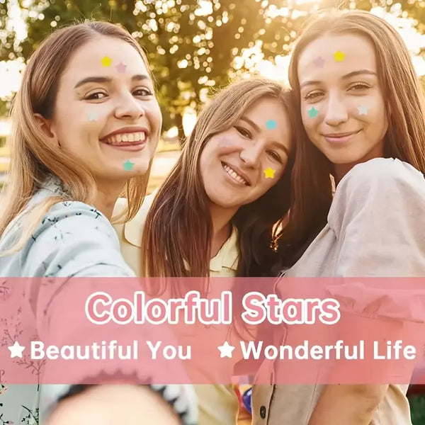 Three smiling women with decorative stars on their faces, surrounded by a bokeh effect.